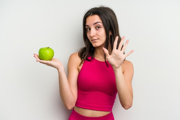 Smiling cheerful showing number five with fingers