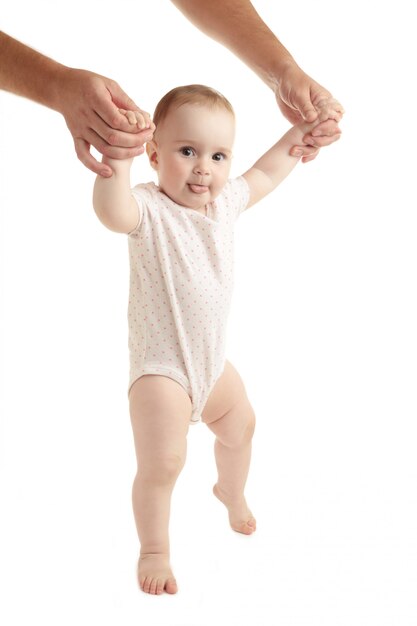 Smiling child walking hand in hand