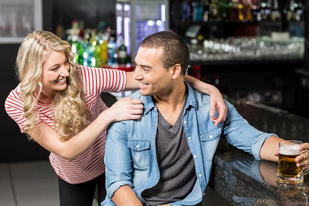 Smiling couple having a drink