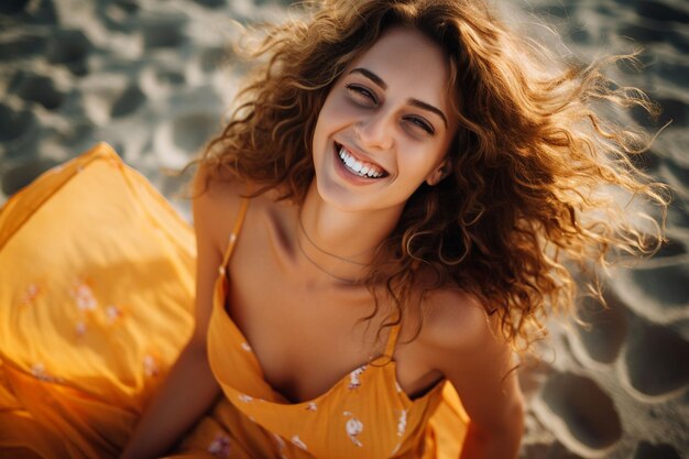 smiling curly woman have fun rolling on sand