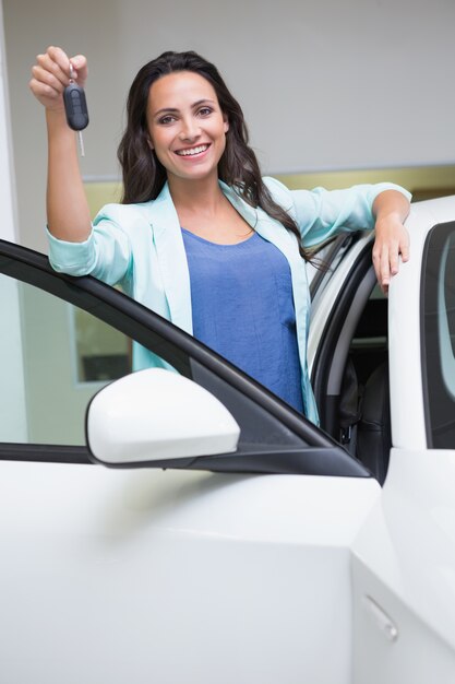 Smiling customer showing her new key 