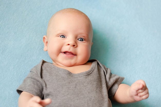 Smiling cute baby boy 3 months old. Portrait close-up