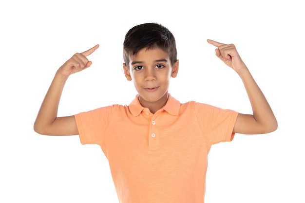 Smiling cute little boy standing and pointing away