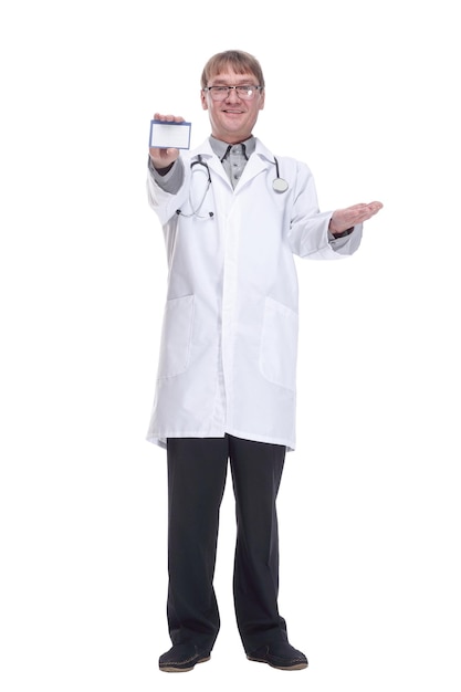 Smiling doctor showing his visiting card isolated on white background