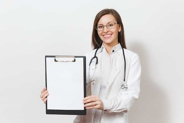 Smiling doctor woman with stethoscope isolated on white background. Female doctor in medical gown holding health card on notepad folder. Healthcare personnel medicine concept. Copy space advertisement