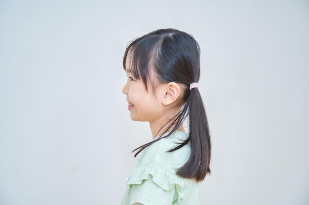 Smiling elementary school girl indoors