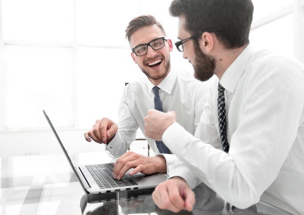 Smiling employees at the Desk in the office