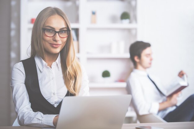 Smiling european woman at workplace