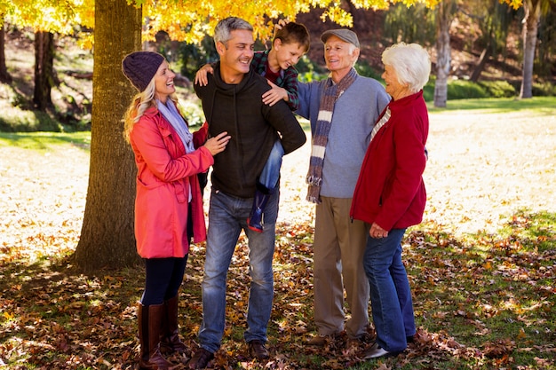 Smiling family and the father holding his son