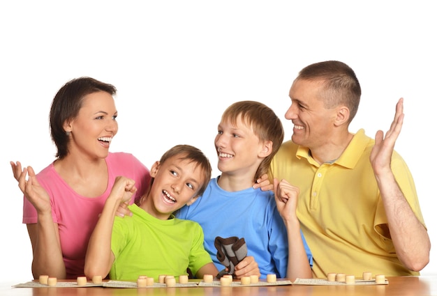 Smiling family playing chess together