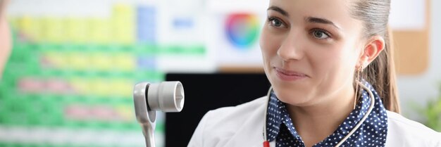 Smiling female doctor neuropathologist with equipment in clinic