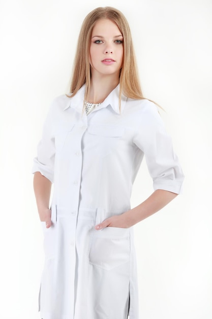 Smiling female doctor with a folder in uniform standing at hospi