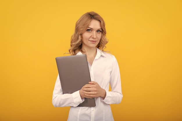 Smiling freelance woman hold wireless computer businesswoman use laptop for blogging