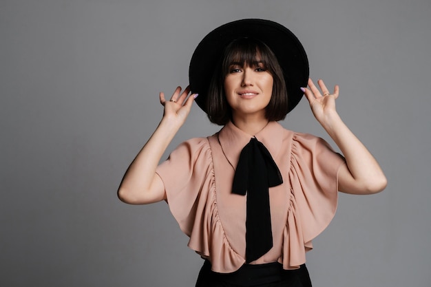 Smiling girl in a hat and blouse