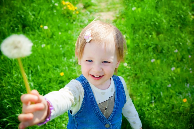 Smiling girl holding a flower