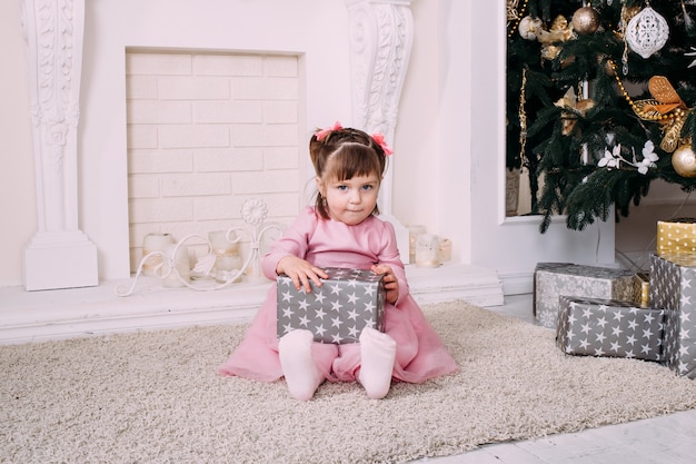 smiling girl with gift box at home