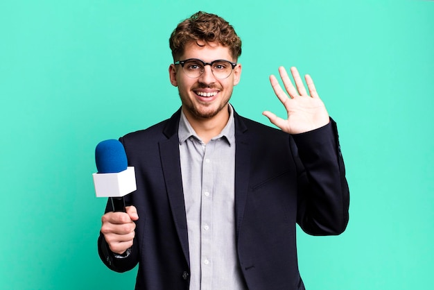 Photo smiling happily waving hand welcoming and greeting you