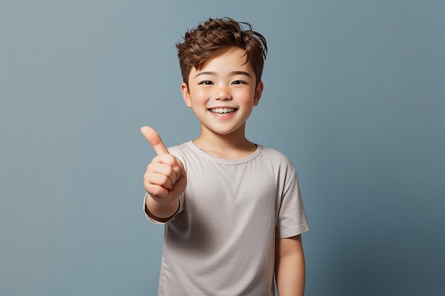 Photo smiling happy boy pointing finger away at over plain background