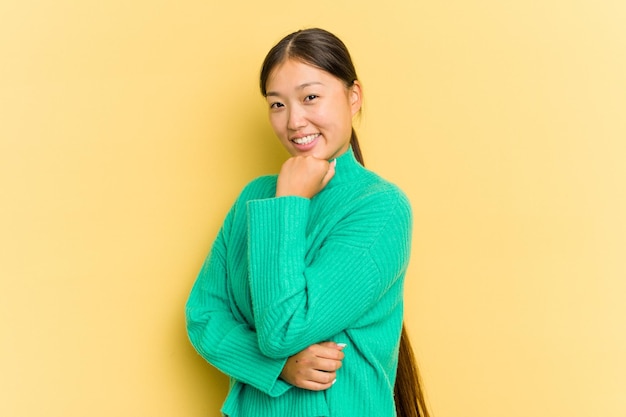 Smiling happy and confident touching chin with hand