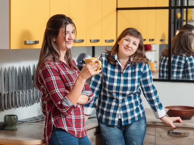 Smiling happy family Mother and daughter in the kitchen