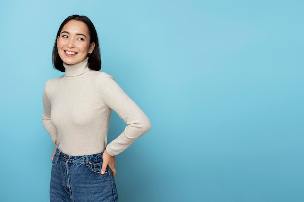 Smiling happy woman looking away with cute positive face