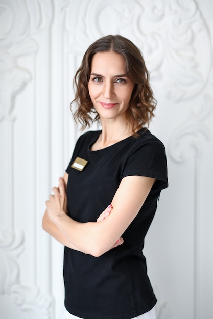 Smiling happy woman with name tag