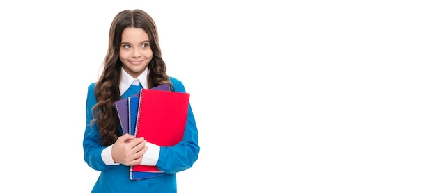 Smiling kid portrait has long curly hair with school workbook isolated on white school Banner