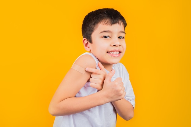 Smiling little boy after having received a vaccination.