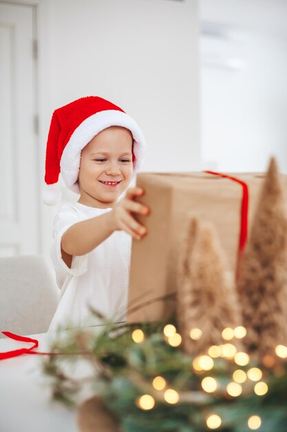 Smiling little boy with a gift box