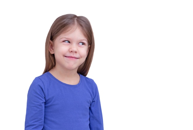 Smiling little girl looking aside at something