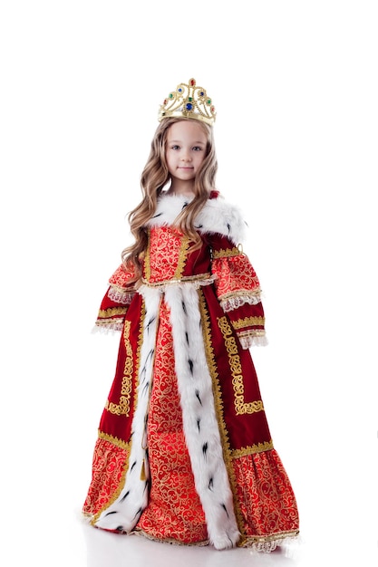 Smiling little girl posing in royal dress