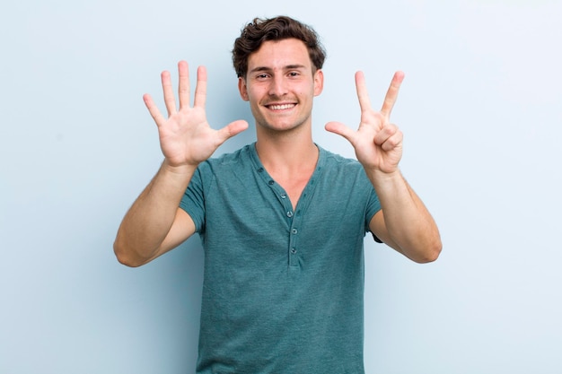 Smiling and looking friendly showing number eight or eighth with hand forward counting down