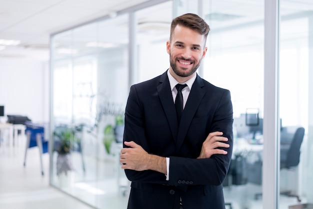 Smiling man with crossed arms