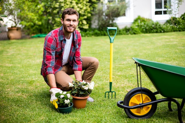 Smiling man woking in yard