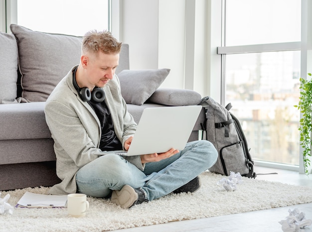 Smiling man working at home