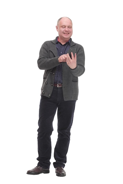 Smiling mature man with a smartphone isolated on a white background