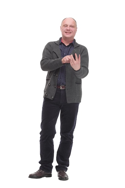 Smiling mature man with a smartphone .isolated on a white background.