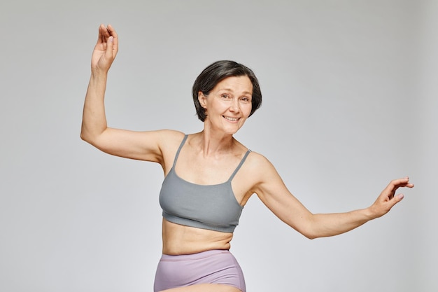 Smiling Mature Woman Dancing