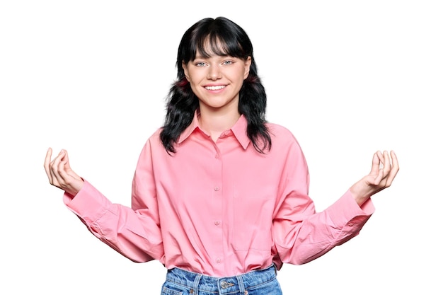 Smiling meditating young female showing om symbol on white isolated background