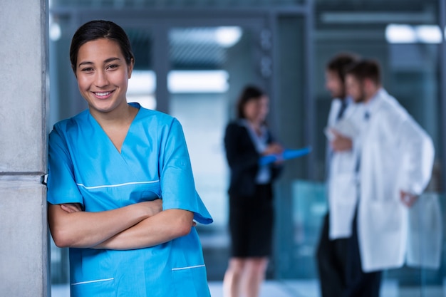 Smiling nurse standing in hospital