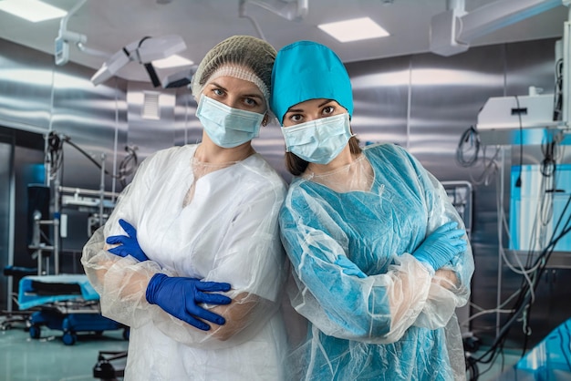 Smiling nurse with another nurse in a hospital corridor