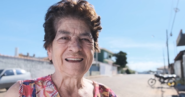 Smiling old Latin woman Beautiful senior woman looking at the camera