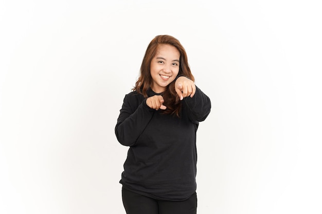 Smiling and Pointing At You Of Beautiful Asian Woman Wearing Black Shirt Isolated On White