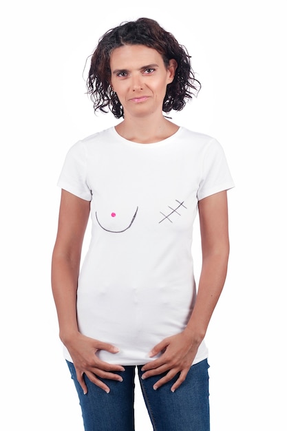 Smiling positive young woman with t-shirt depicting  awareness for breast cancer. Mastectomy concept