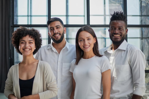 Smiling professional business leaders and employees group team portrait