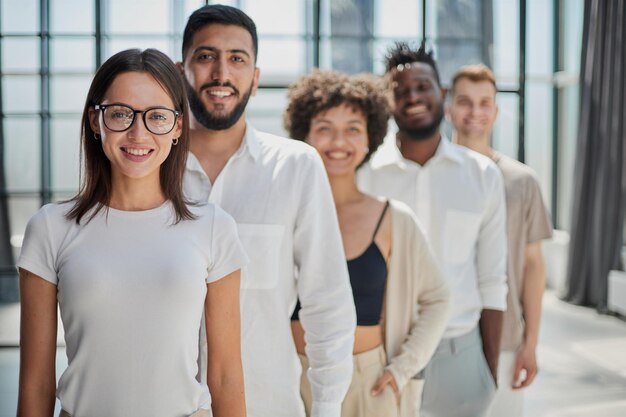 Smiling professional business leaders and employees group team portrait