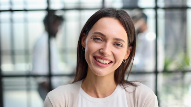 Smiling professional business leaders and employees group team portrait