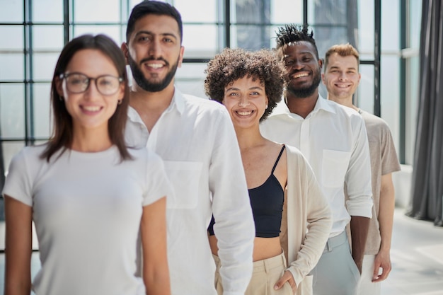 Smiling professional business leaders and employees group team portrait