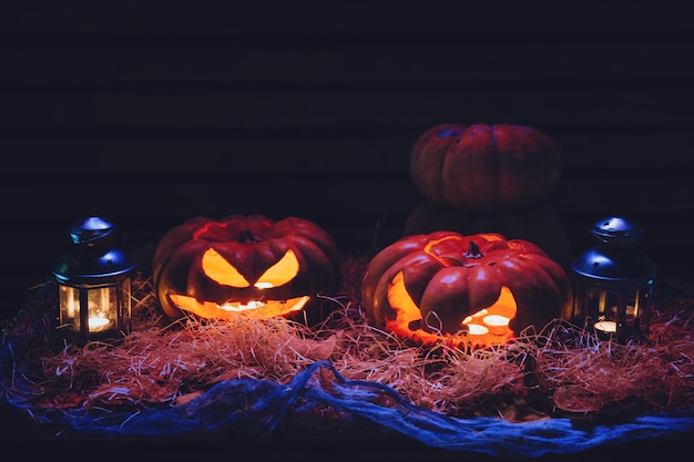 Smiling pumpkins on straws