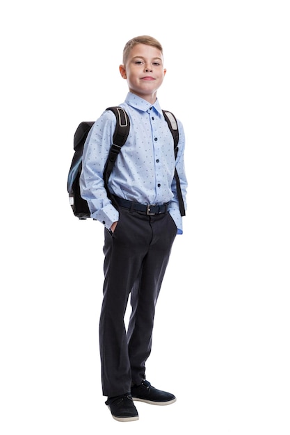 Smiling schoolboy with a backpack Guy in trousers and a blue shirt Education and knowledge Isolated on white background Vertical